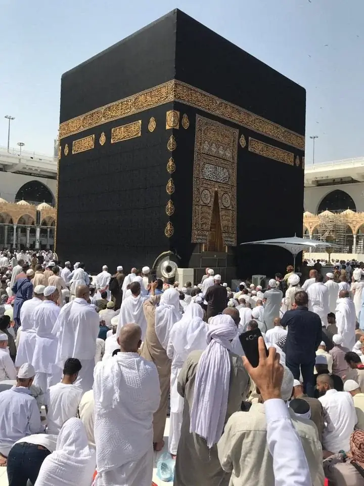 Umrah pilgrims gathered near the Kaaba at Masjid al-Haram in Makkah