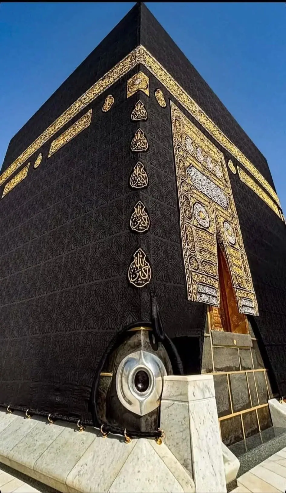Close-up view of the Kaaba door and Hajar-e-Aswad in Makkah